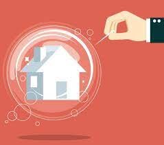 image of a hand, holding a pin, about to pop a balloon with a house in it, signifying market saturation
