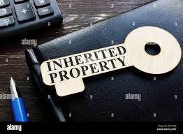 image of a key with the words "inherited property" on it