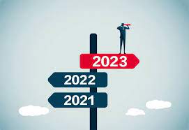 image of a man standing on signs that read past years referring to the future