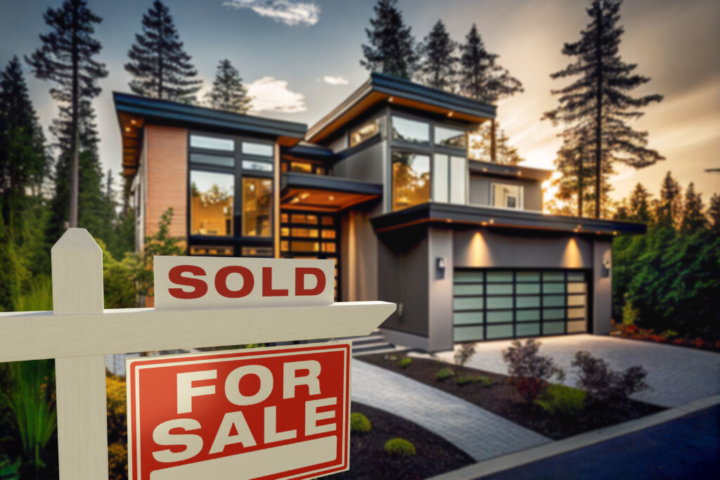 Sold Home For Sale Real Estate Sign in Front of Modern House