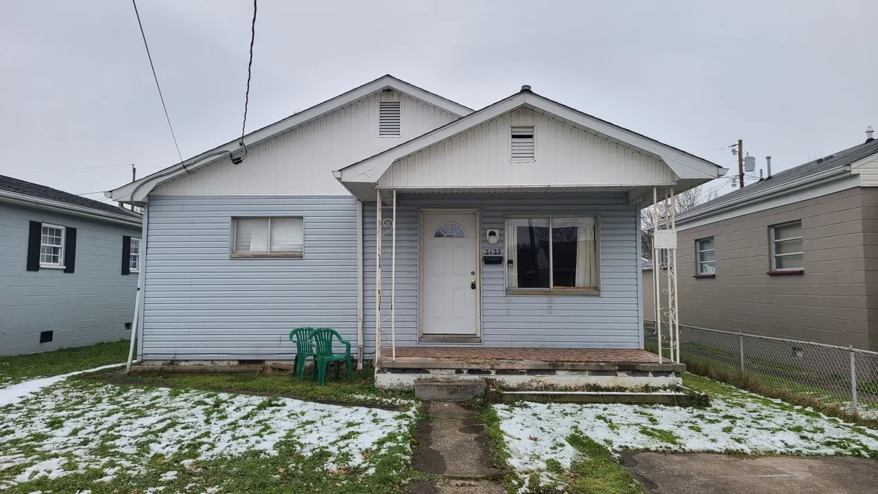 Front exterior of the McKinley Avenue house in St. Albans in the early project photos