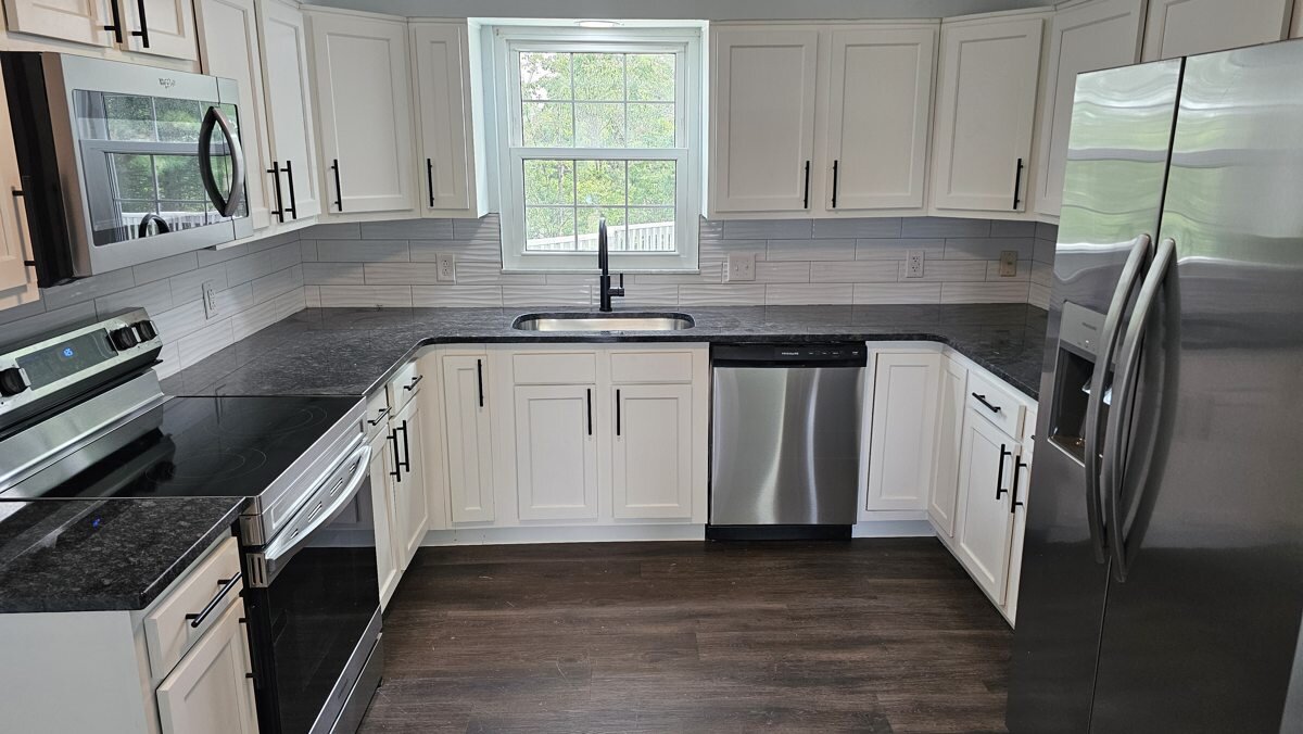 Glow Drive kitchen with updated counters, appliances, and flooring in the after photos
