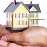 Person holding a home
