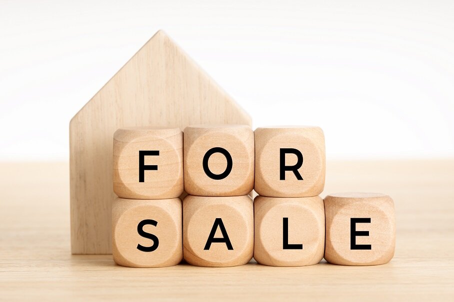 For Sale concept. Real estate market. Wooden blocks with text and house icon. Copy space. White background