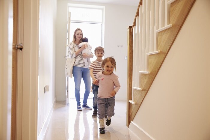 Young Family Looking Around Property For Sale