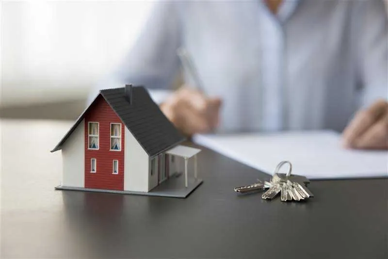A set of house keys and estate paperwork