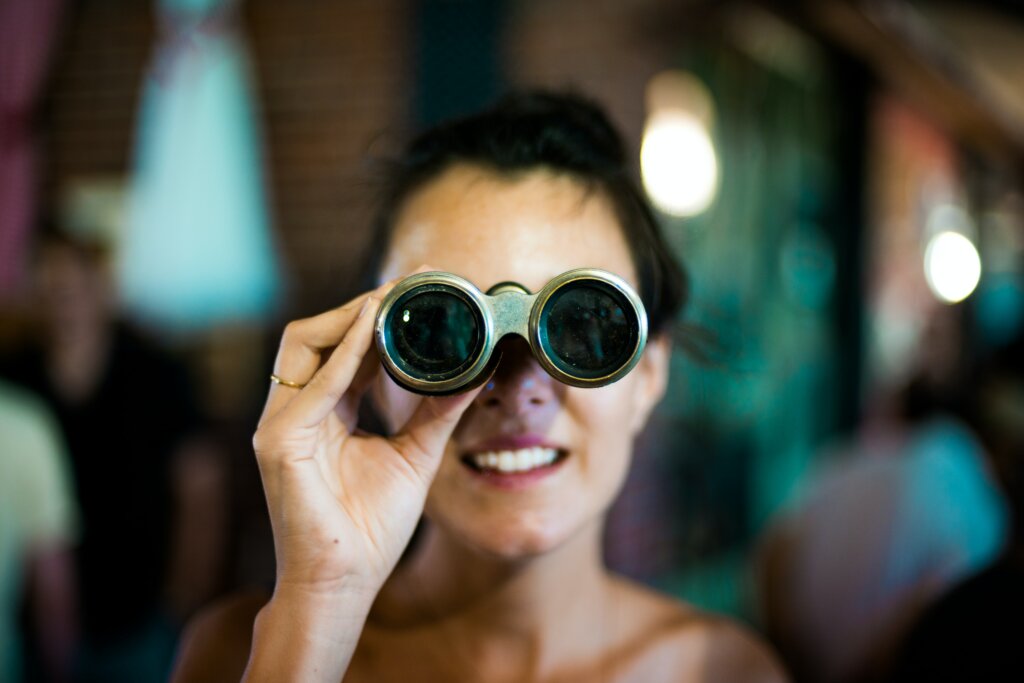 Exploring All of Your Options When Selling Your House in the Greater Cincinnati Area or Cincinnati - women looking through binoculars
