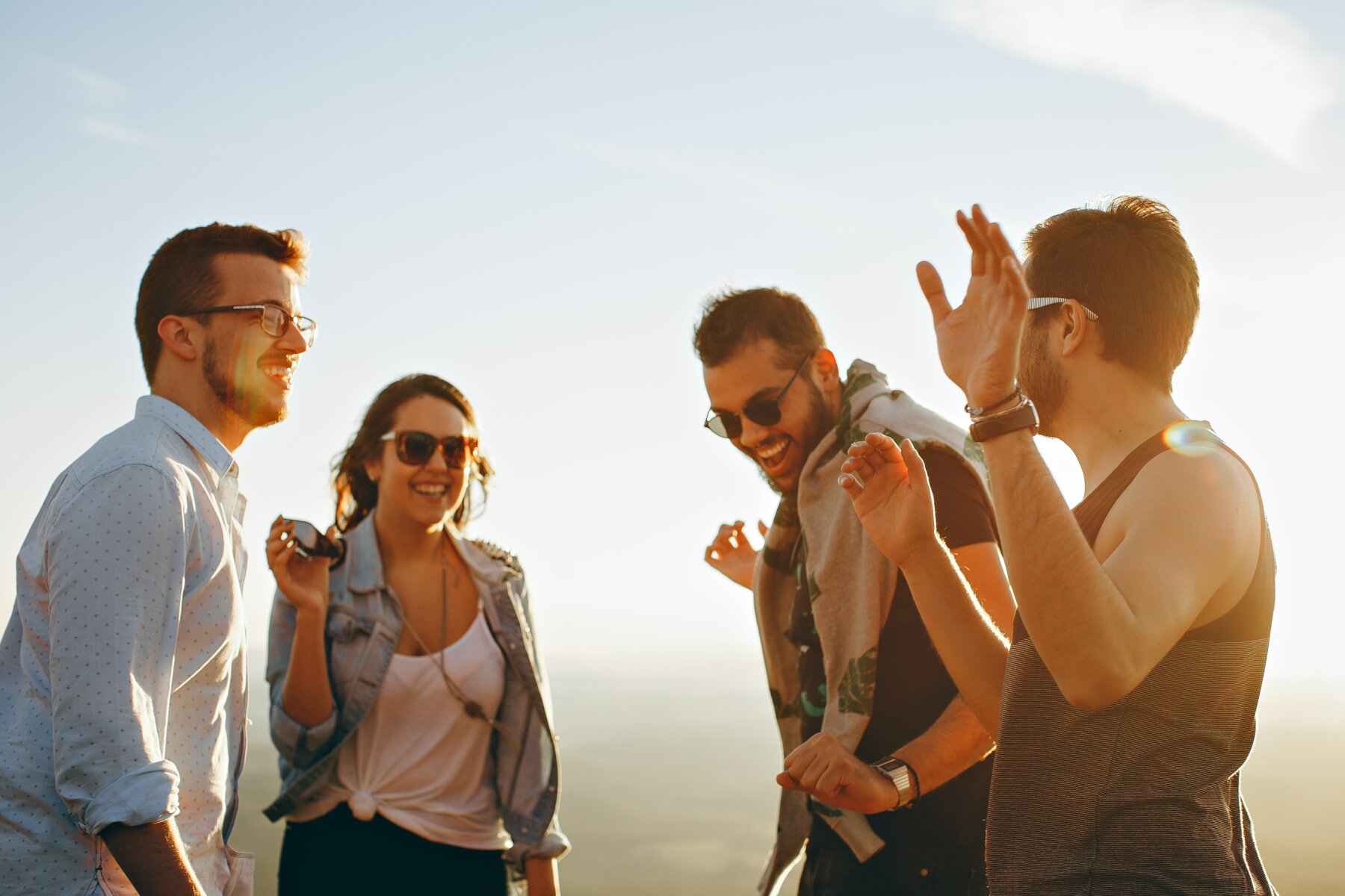 Pros and Cons of Owning a Vacation Rental in [market_city] or Cincinnati - People hanging out.