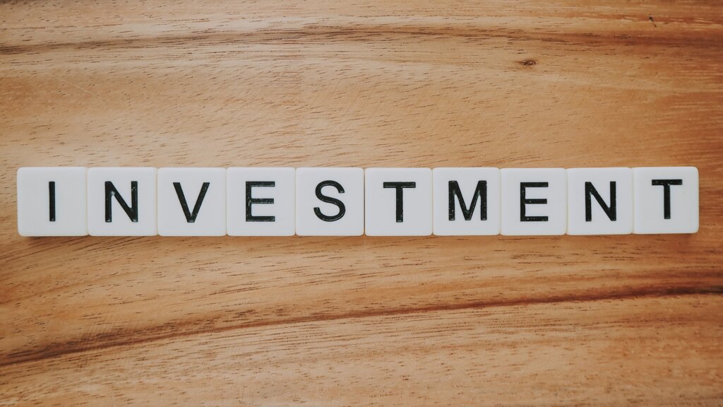 Alternative the Greater Cincinnati Area or Cincinnati Real Estate Investment Methods: Notes, REITs, and Wholesaling Explained - scrabble letters spelling investment