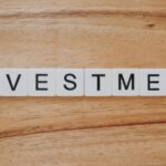 Alternative the Greater Cincinnati Area or Cincinnati Real Estate Investment Methods: Notes, REITs, and Wholesaling Explained - scrabble letters spelling investment