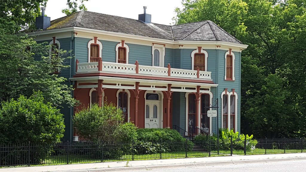 A large home painted in red and blue