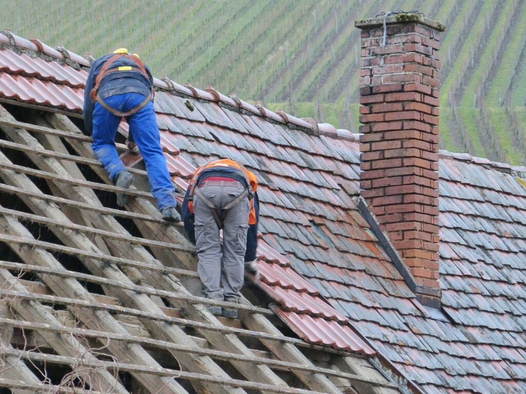 Men repairing a roof.