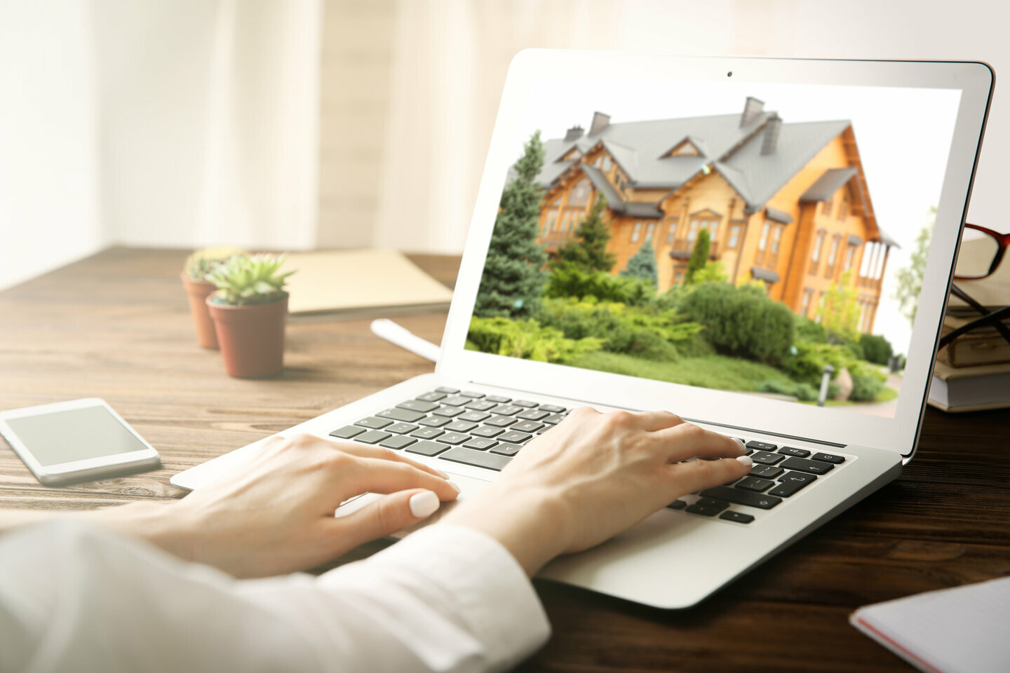 Woman using technology to buy a house