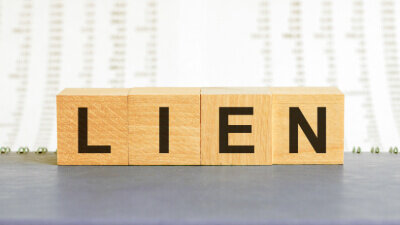 You need to know the status of liens and debts of an inherited house before taking any action
