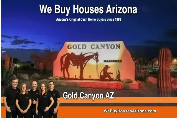 The We Buy Houses Arizona team with the Gold Canyon community sign at dusk.