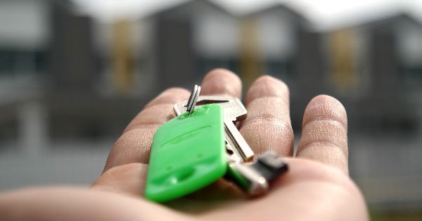 keys for a house for sale on the palm of a hand