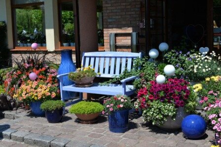 Entrance bench surrounded by flowers