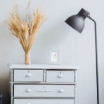 Ways to Stage Your House for a Winter Sale | lamp and dresser