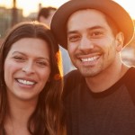 Turn a Profit Flipping Property | smiling hispanic couple sunset