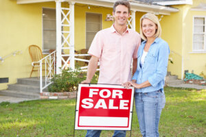 A smiling couple confident in selling their their home after praying the St Joseph prayer.