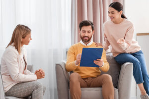 Real estate agent discussing sale documents with a homeowner