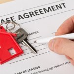 looking over lease agreement to sell house with tenants