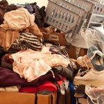 pile of clothes in a hoarder house