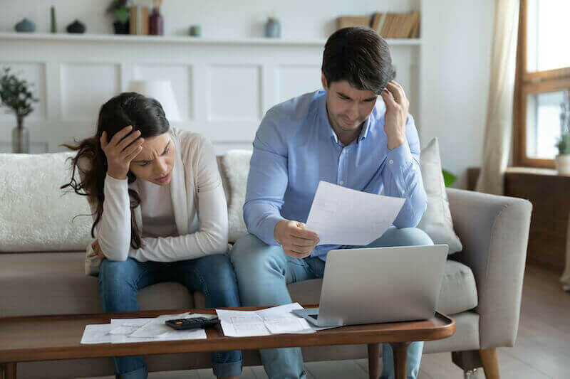 Couple Working Out Why They Are In Debt
