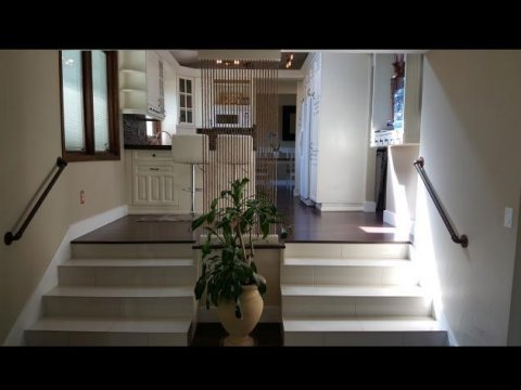 Dual staircases in a home in Sandy UT with seller financing