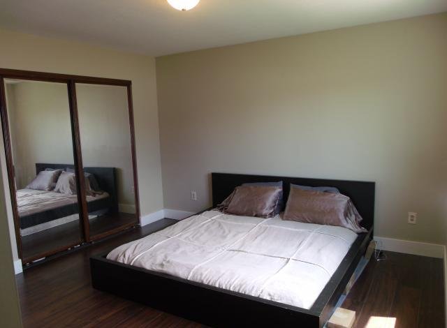 Bedroom with dark hardwood floors with seller financing Sandy UT