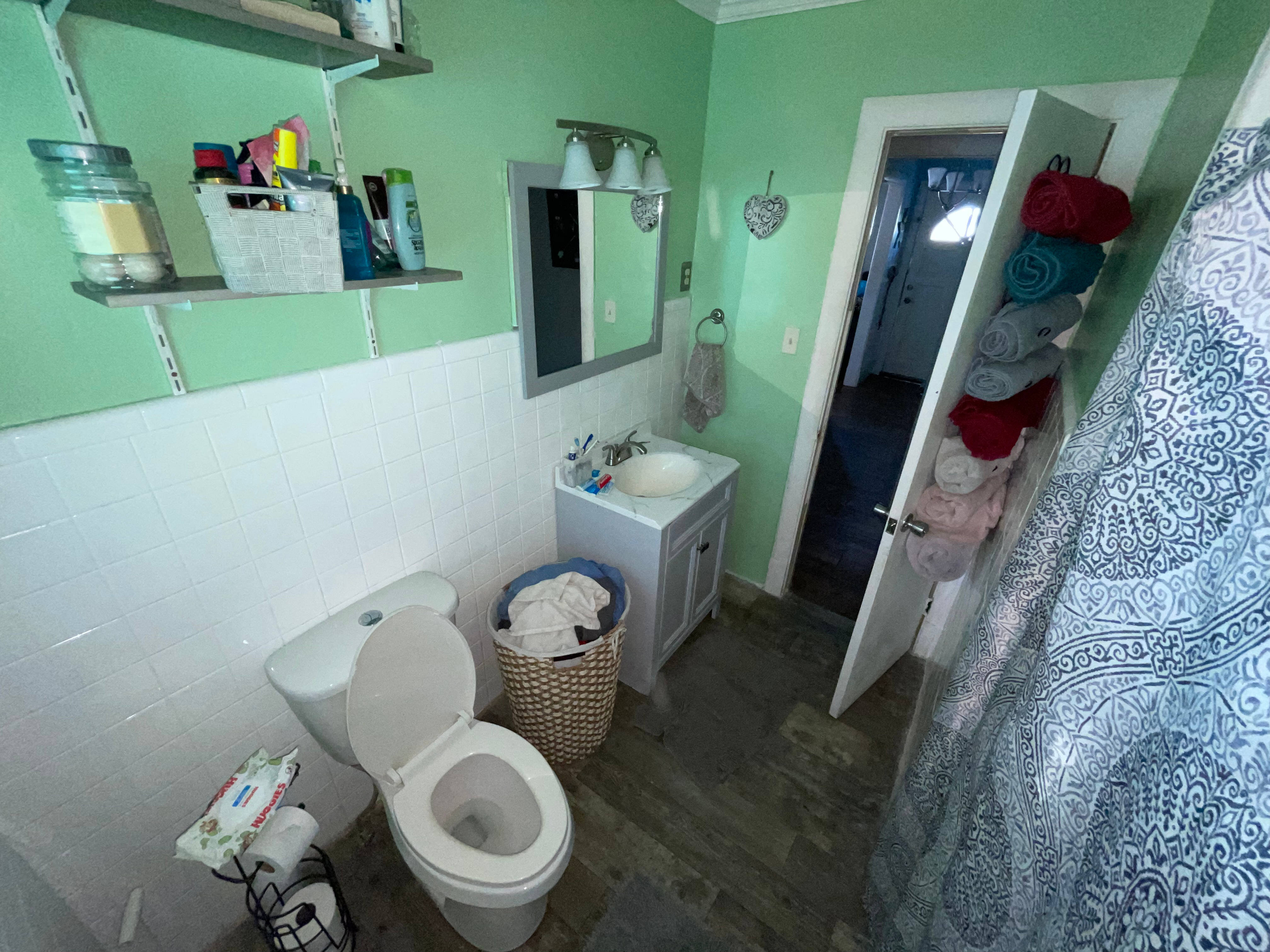 Bathroom before licensed renovation at a Devon Park Wilmington house