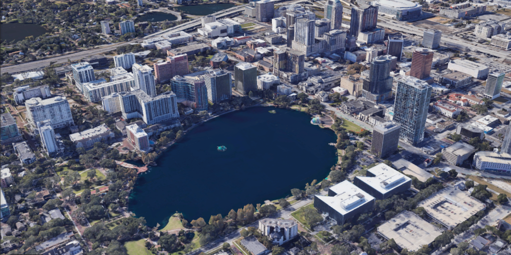 FL Aerial view of downtown showcasing the city’s skyline and Lake Eola.