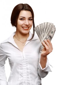 Happy young woman holding money