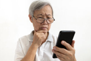 senior man puzzled by annoying calls from direct home buyers
