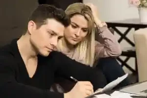 couple seeking answers to frequently asked questions for us direct home buyers