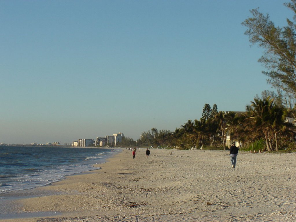 people walking on Bonita Beach in Bonita Springs FL