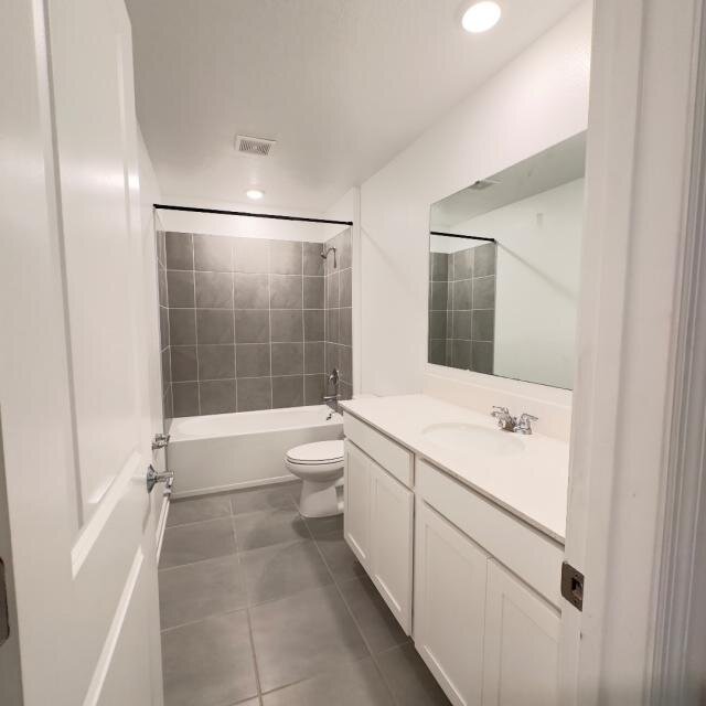 Bathroom at 1002 John Jacob Rd with a white vanity and tiled tub surround