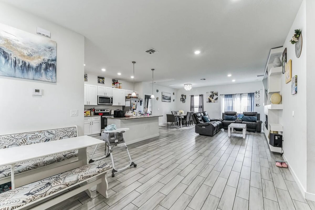 Living room and kitchen at 1030 James Dr in Poinciana, Florida
