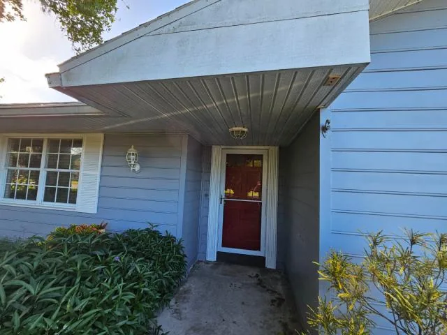 Front entry of 1499 Van Eck Rd NE in Palm Bay, Florida, in a seller-provided photo