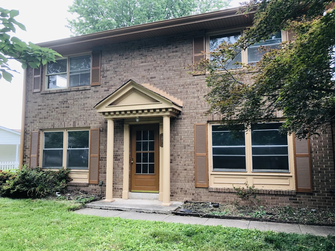 Two-story brick home with a covered front entry