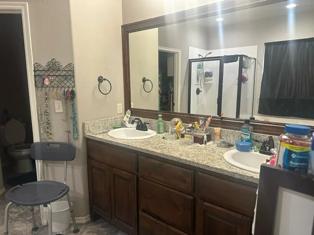 Bathroom with a double vanity at 20507 East 31st Place South