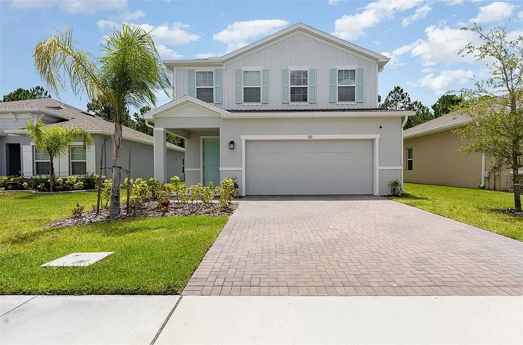 Front exterior and driveway at 321 Crest Wind Dr in Daytona Beach, Florida