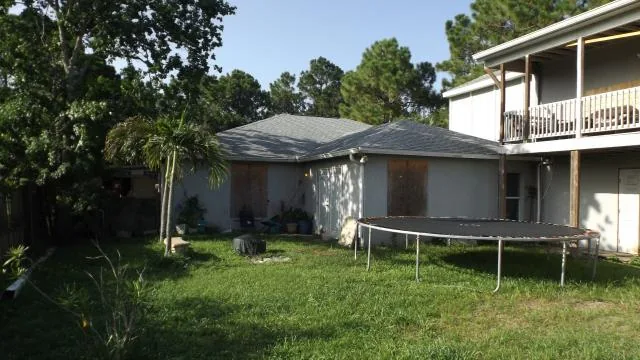 Rear exterior of 434 Lambert St SW in Palm Bay, Florida, in a seller-provided photo