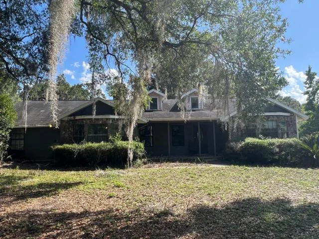 House and shaded yard before renovation