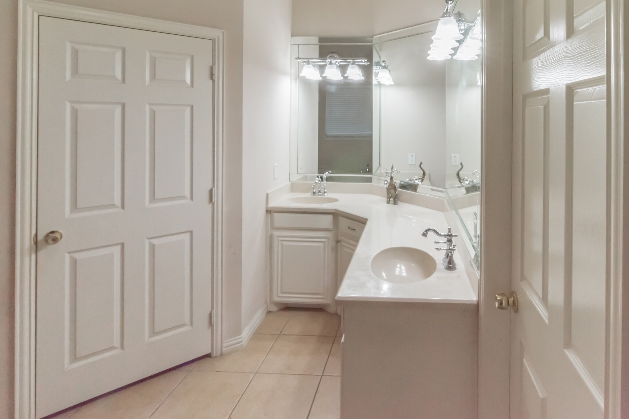 Bathroom with two sinks and corner vanity at 2067 Chevella Dr in Dallas