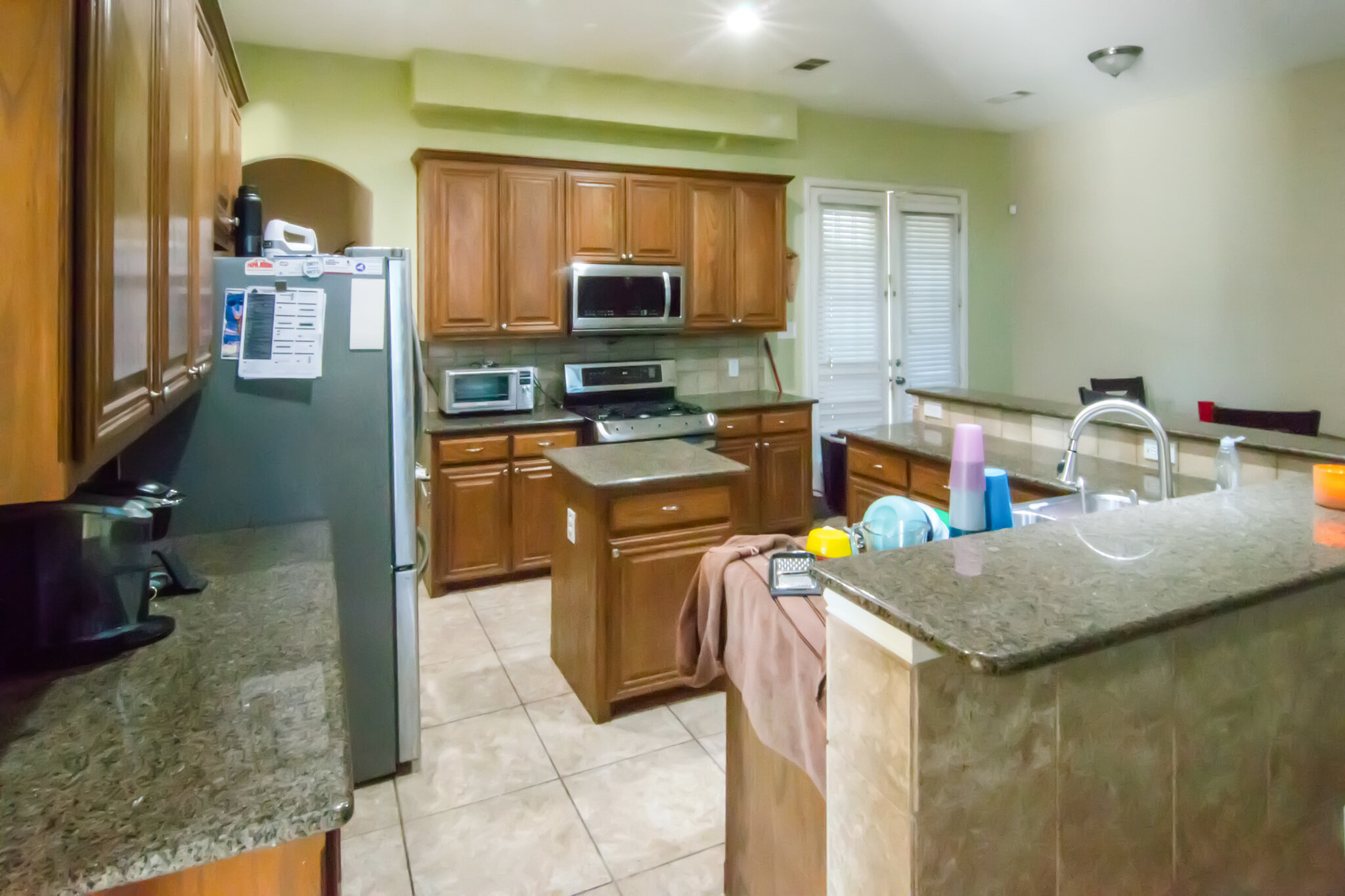 Kitchen with wood cabinets and center island at 2067 Chevella Dr in Dallas