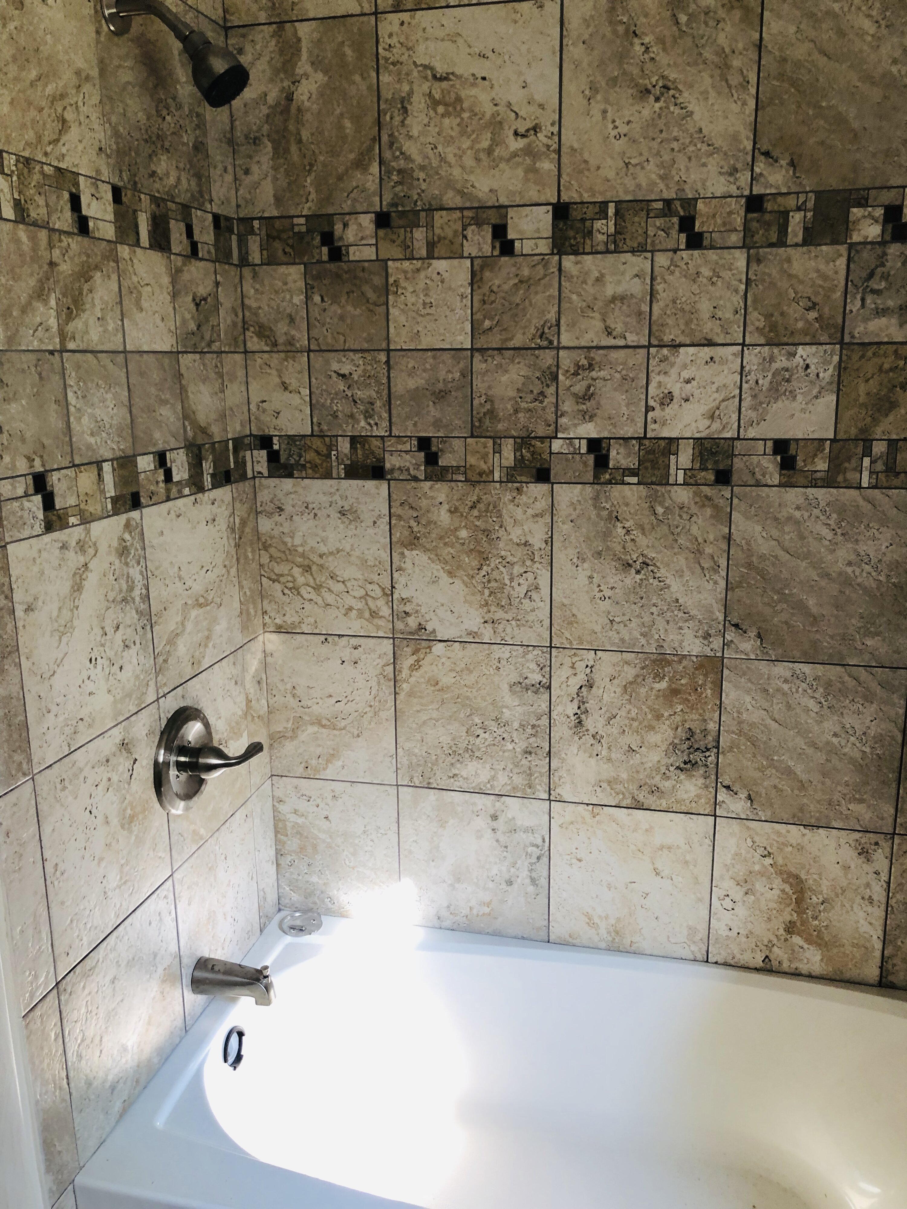 Tub and tiled shower surround at 14317 Ferndale Rd before updates