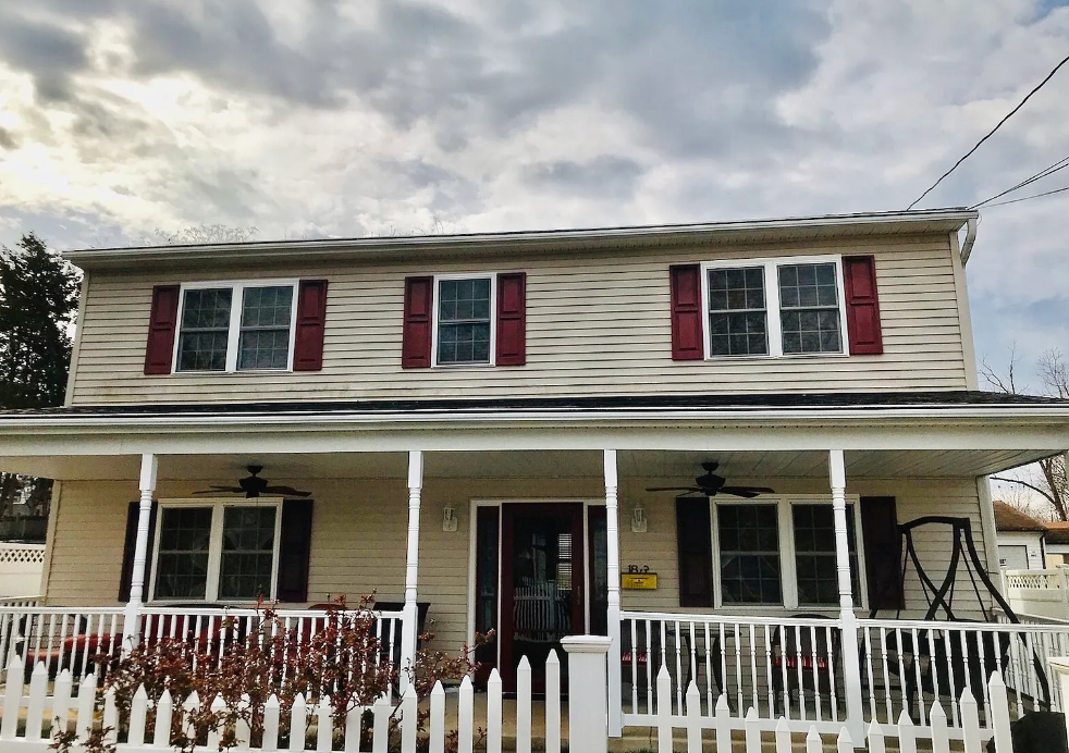 Front of 183 Holden Dr in Manassas Park, showing the covered porch and upper-story windows