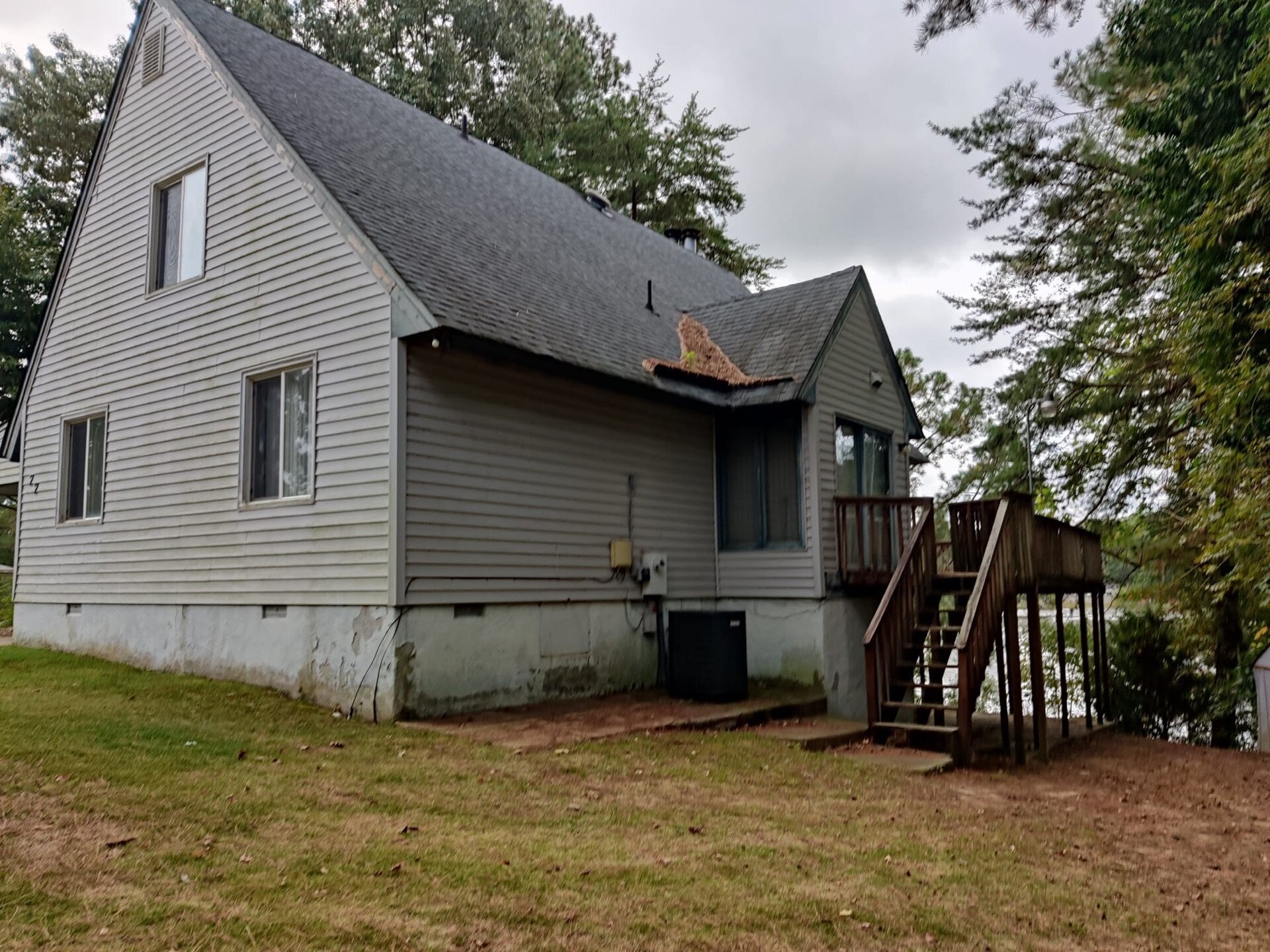 Exterior of 77 Linda Dr in Newport News, showing the gray siding and entry steps
