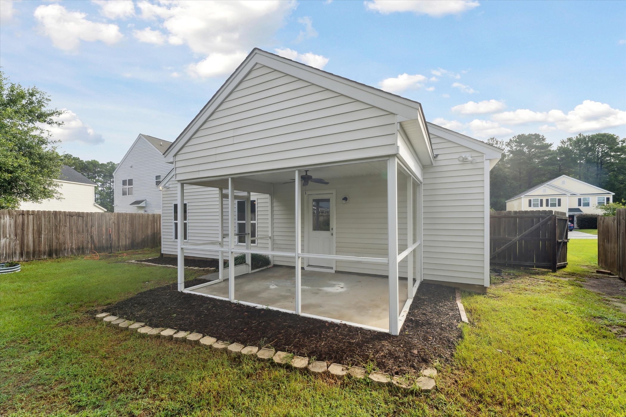 Rear porch and yard at 445 Lions Den Dr after cleanup and landscaping